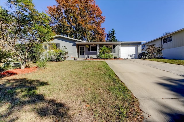 single story home featuring a front yard and a garage