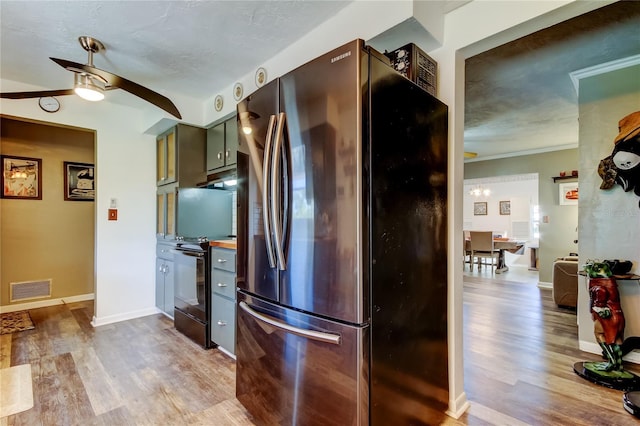 kitchen featuring stainless steel fridge, ornamental molding, ceiling fan, light hardwood / wood-style flooring, and black electric range