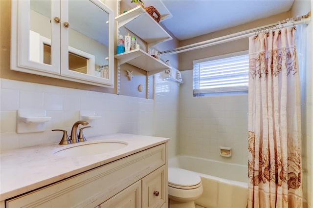 full bathroom featuring vanity, toilet, shower / bath combo with shower curtain, tile walls, and tasteful backsplash