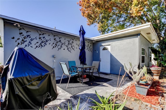 rear view of house featuring a patio