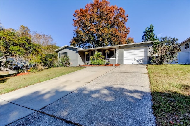 ranch-style house with a front yard and a garage