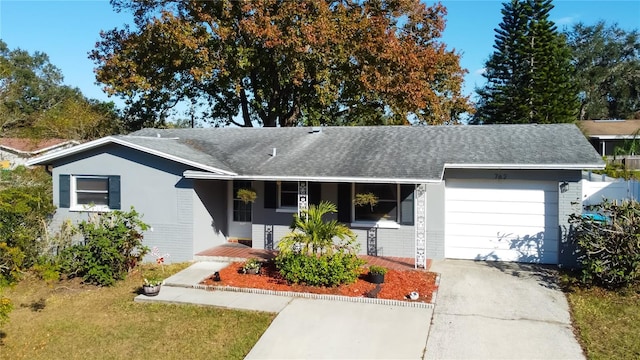 single story home featuring a porch and a garage