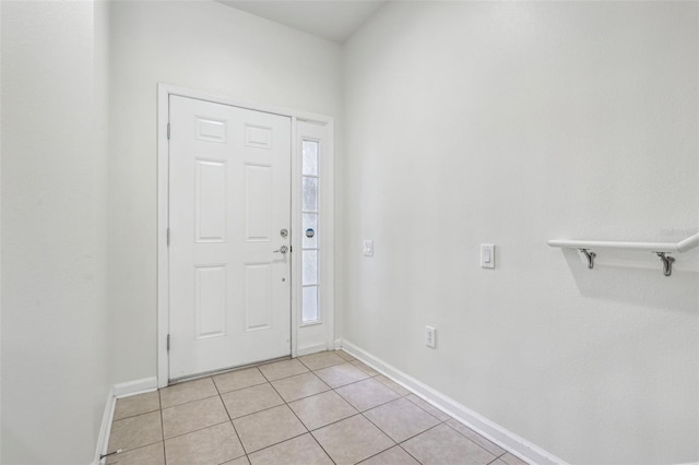 foyer entrance featuring light tile patterned floors