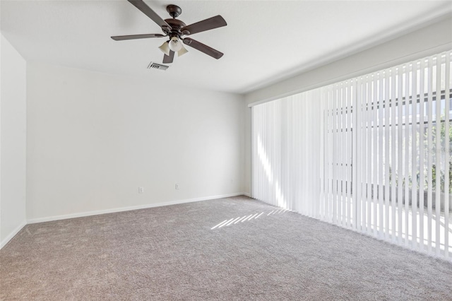 carpeted empty room with ceiling fan