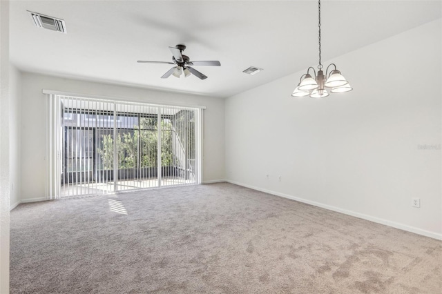 spare room with carpet floors and ceiling fan with notable chandelier