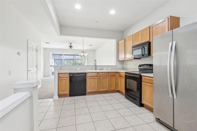 kitchen featuring kitchen peninsula, ceiling fan, sink, black appliances, and light tile patterned flooring