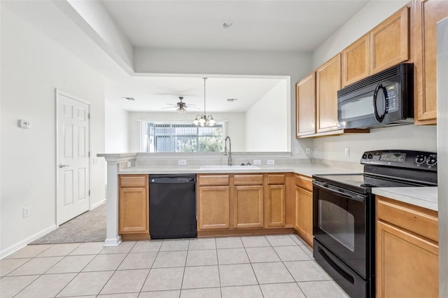 kitchen with ceiling fan, sink, kitchen peninsula, light tile patterned floors, and black appliances