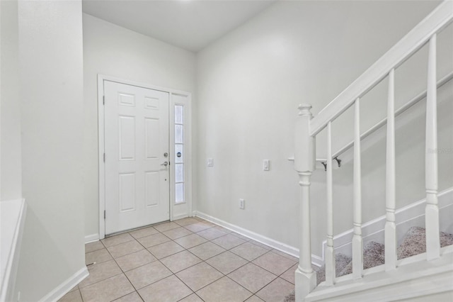 entrance foyer featuring light tile patterned floors