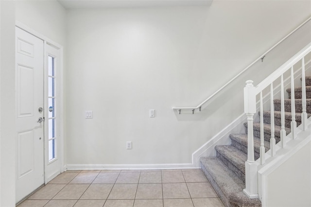 entryway featuring light tile patterned floors