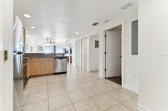 11605 Gulf Blvd Unit 507, Treasure Island, FL 33706 - kitchen featuring appliances with stainless steel finishes, a peninsula, a textured ceiling, a sink, and electric panel