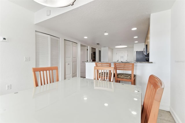 11605 Gulf Blvd Unit 507, Treasure Island, FL 33706 - dining room featuring recessed lighting and a textured ceiling
