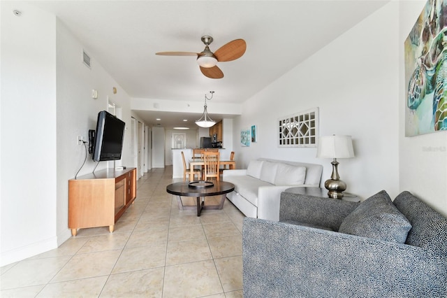 11605 Gulf Blvd Unit 507, Treasure Island, FL 33706 - living room with ceiling fan, light tile patterned floors, and baseboards