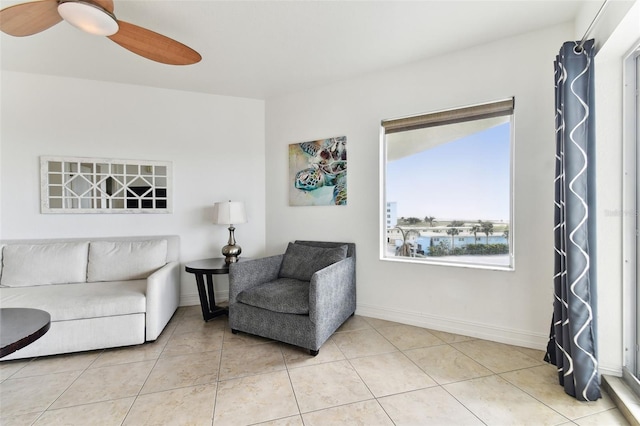 living room with tile patterned flooring and ceiling fan