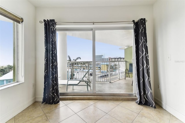 spare room featuring light tile patterned floors