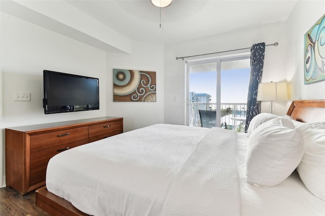 bedroom featuring dark hardwood / wood-style flooring, ceiling fan, and access to exterior