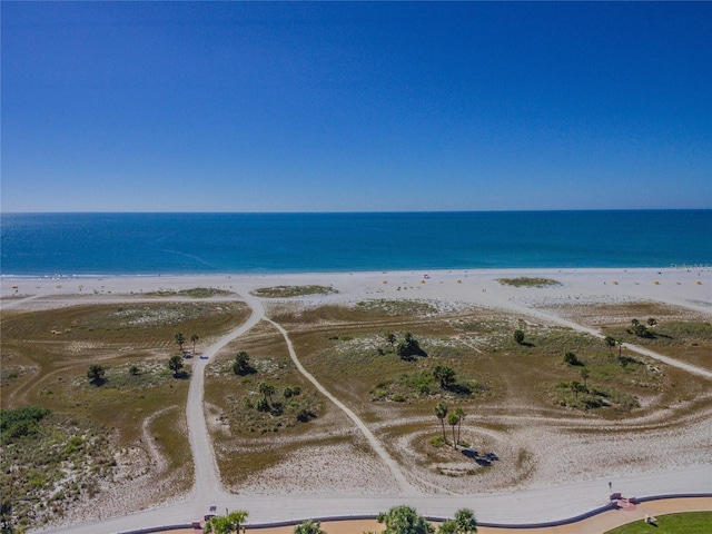 birds eye view of property with a view of the beach and a water view