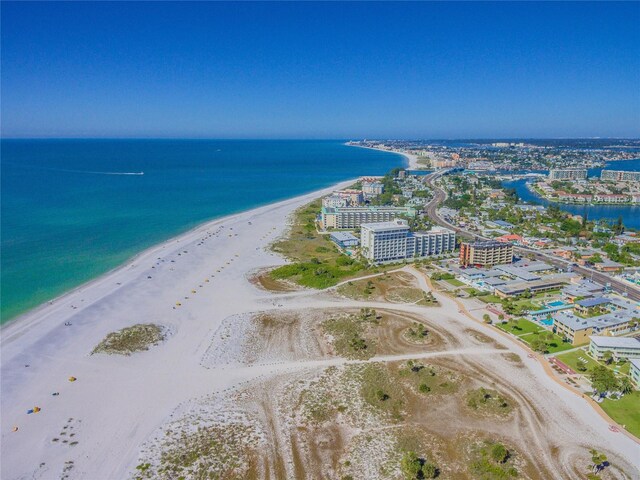 birds eye view of property featuring a view of the beach and a water view