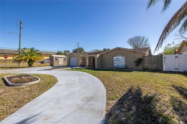 ranch-style house with a garage and a front yard