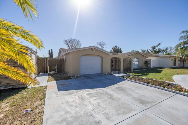 single story home with a garage and a front yard