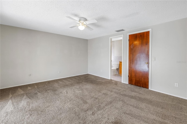 carpeted empty room with a textured ceiling and ceiling fan