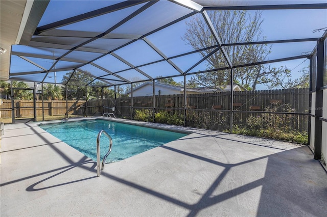 view of pool featuring a patio and glass enclosure