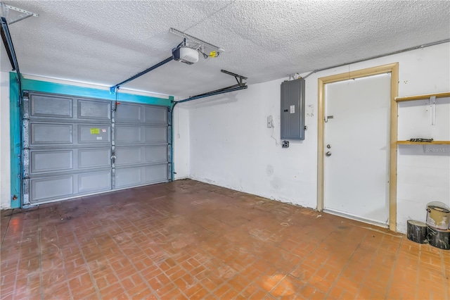 garage featuring a garage door opener and electric panel