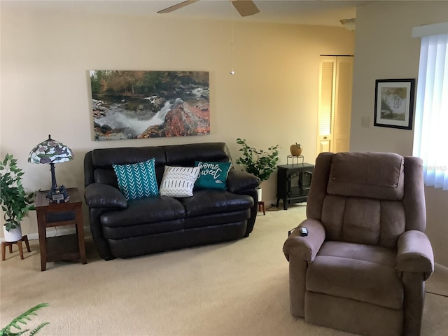 living room with ceiling fan, carpet, and a healthy amount of sunlight