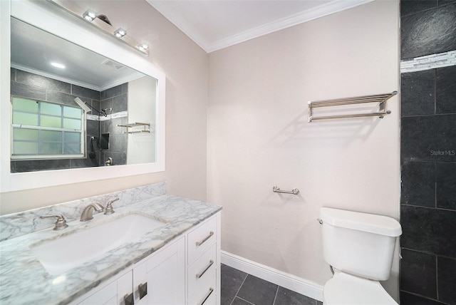 bathroom featuring a tile shower, tile patterned floors, crown molding, toilet, and vanity