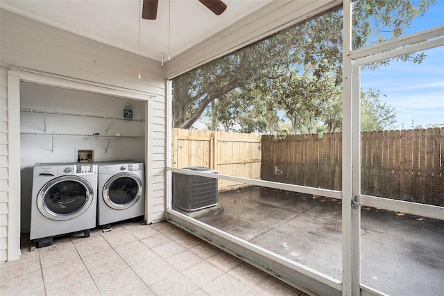 laundry area with ceiling fan and washing machine and dryer