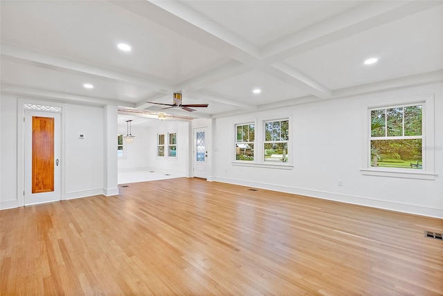 unfurnished living room with beam ceiling, ceiling fan, and light wood-type flooring