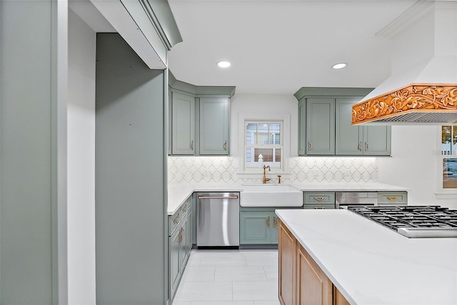 kitchen featuring sink, premium range hood, appliances with stainless steel finishes, backsplash, and light tile patterned flooring