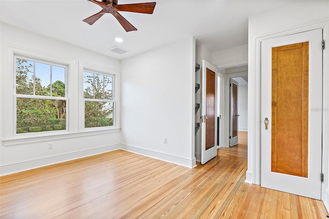 unfurnished room featuring ceiling fan and light hardwood / wood-style flooring