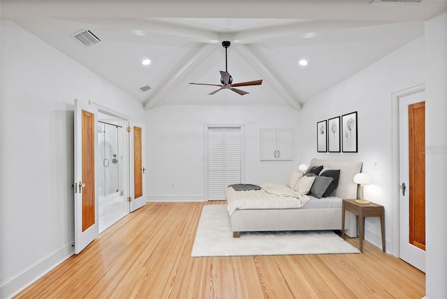 bedroom featuring ceiling fan, vaulted ceiling with beams, and light wood-type flooring