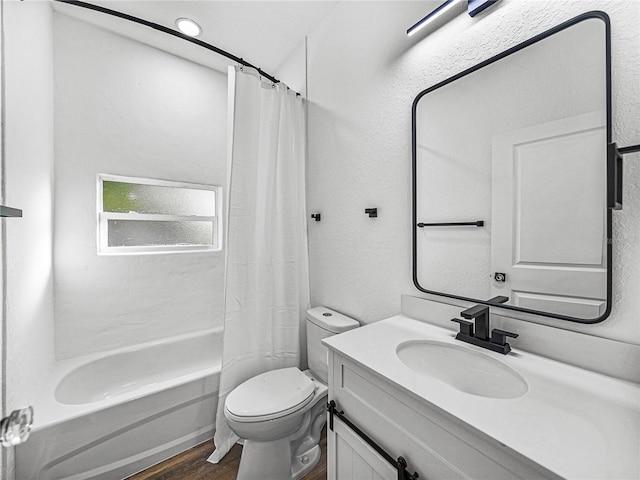 full bathroom with hardwood / wood-style floors, vanity, toilet, and shower / bathtub combination with curtain