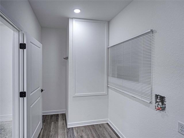 hallway featuring dark hardwood / wood-style flooring