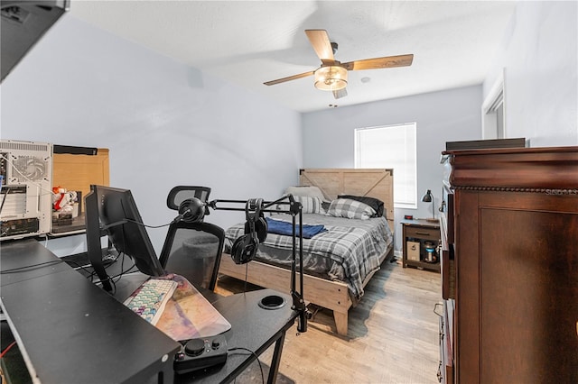 bedroom featuring ceiling fan and light hardwood / wood-style floors