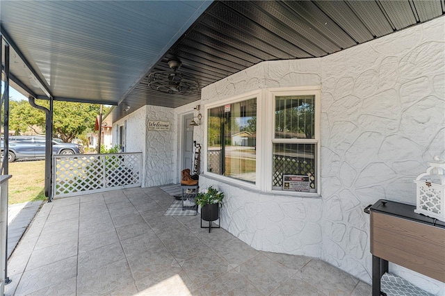 view of patio featuring ceiling fan