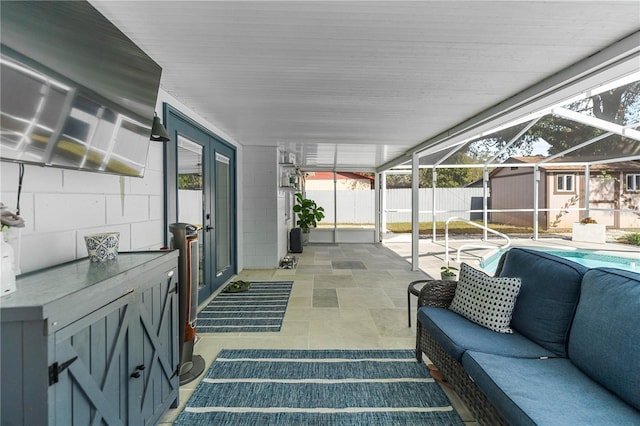 sunroom / solarium featuring plenty of natural light