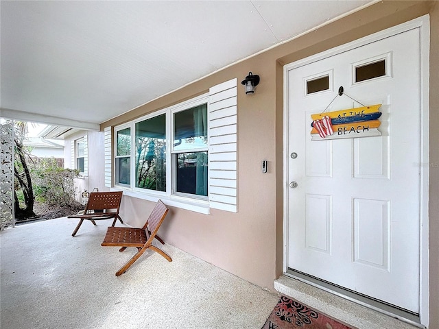 doorway to property with covered porch