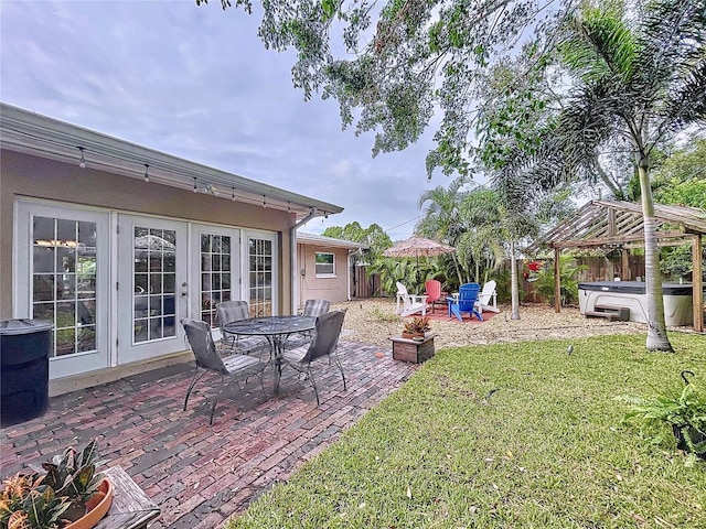 view of patio / terrace featuring a gazebo and a hot tub