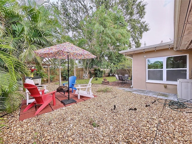 view of yard with a patio area and an outdoor fire pit