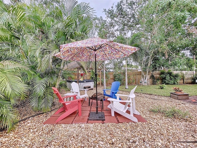 view of patio with an outdoor fire pit