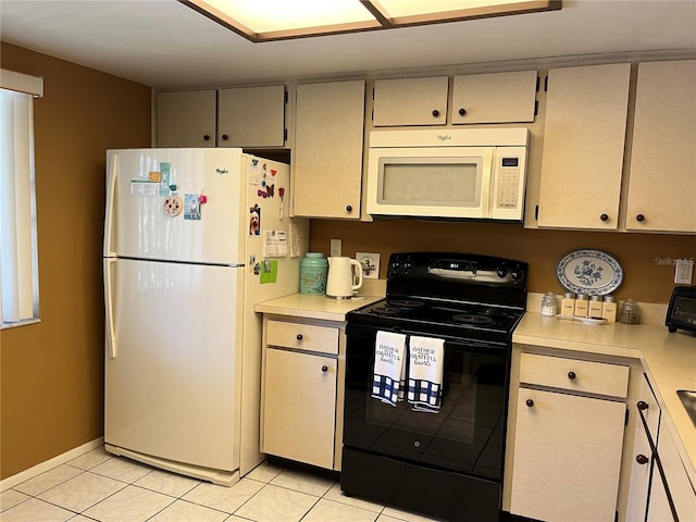 kitchen with light tile patterned floors and white appliances