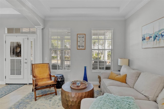 interior space featuring crown molding, a tray ceiling, light tile patterned flooring, and ornate columns