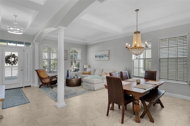 tiled dining area with a notable chandelier, ornamental molding, and decorative columns