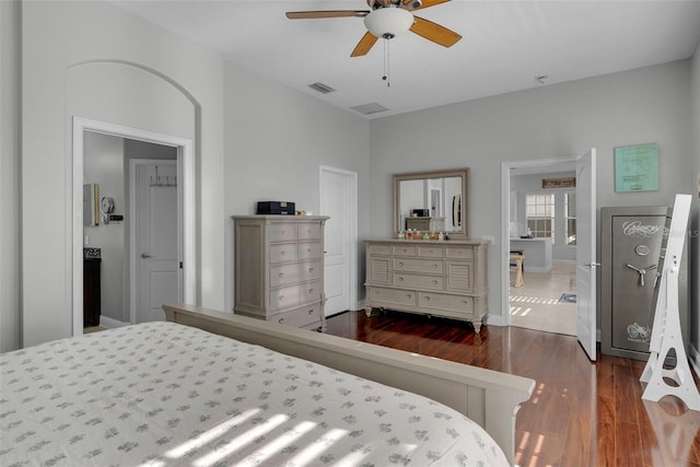 bedroom with ceiling fan and dark hardwood / wood-style flooring