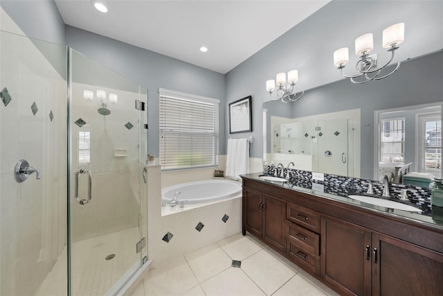 bathroom featuring tile patterned flooring, vanity, and separate shower and tub