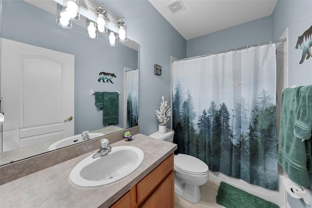 bathroom featuring vanity, tile patterned flooring, toilet, and an inviting chandelier