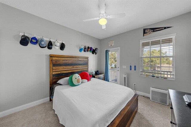 bedroom featuring ceiling fan, access to exterior, and light carpet