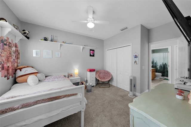 carpeted bedroom featuring a closet and ceiling fan